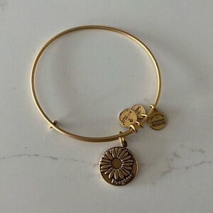 Alex and Ani gold bracelet, daughter charm.